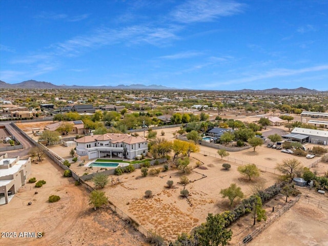 birds eye view of property with a mountain view