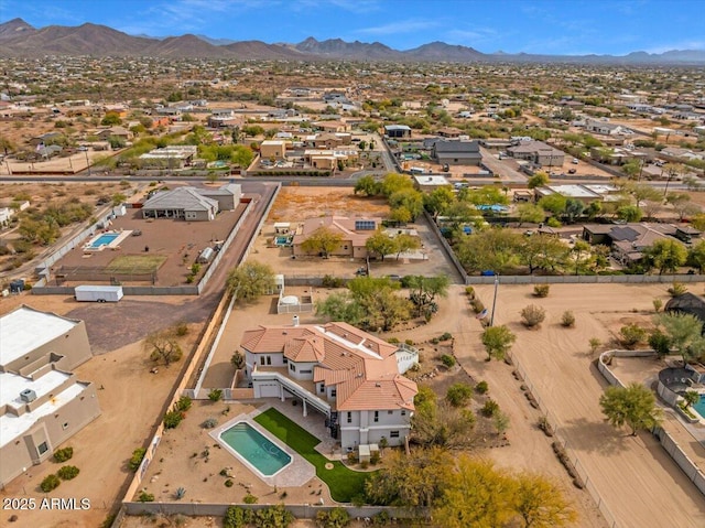 drone / aerial view featuring a residential view and a mountain view