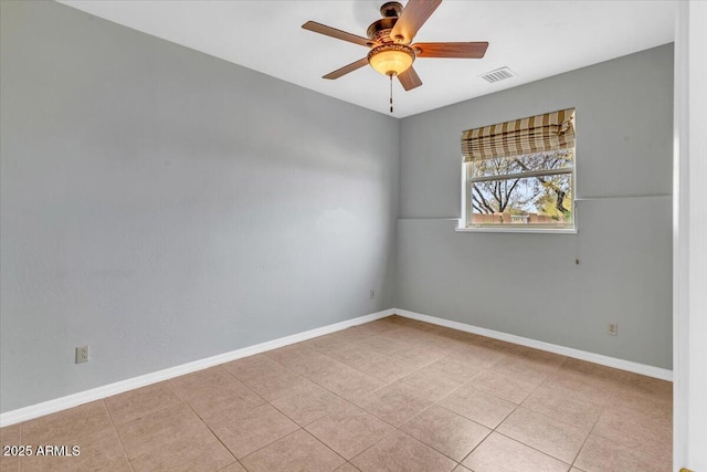 unfurnished room with a ceiling fan, visible vents, baseboards, and light tile patterned floors