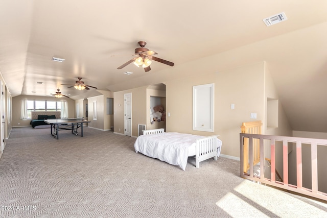 carpeted bedroom featuring ceiling fan and vaulted ceiling