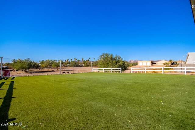 view of yard with a rural view