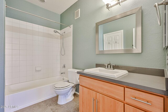 full bath with tile patterned floors, visible vents, toilet, shower / bath combination, and vanity