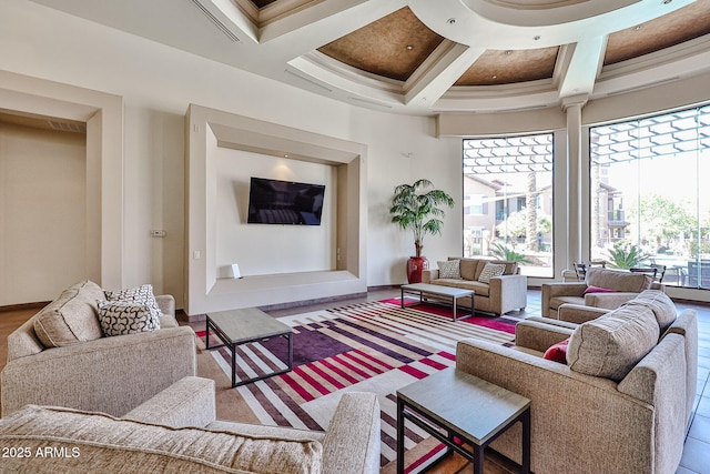 living room featuring beamed ceiling, coffered ceiling, and a high ceiling