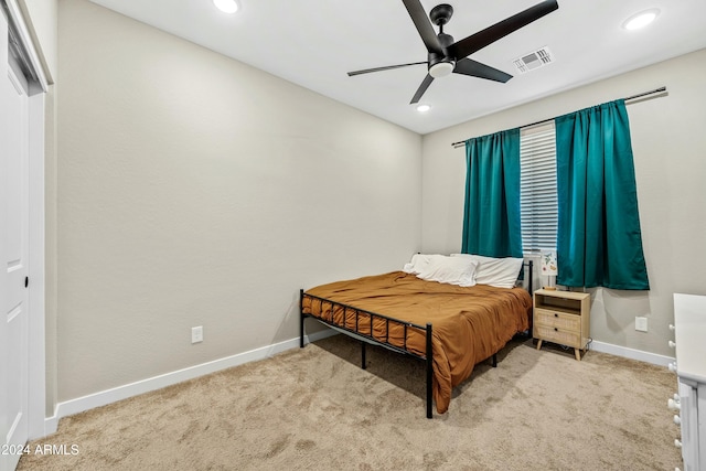 carpeted bedroom with ceiling fan