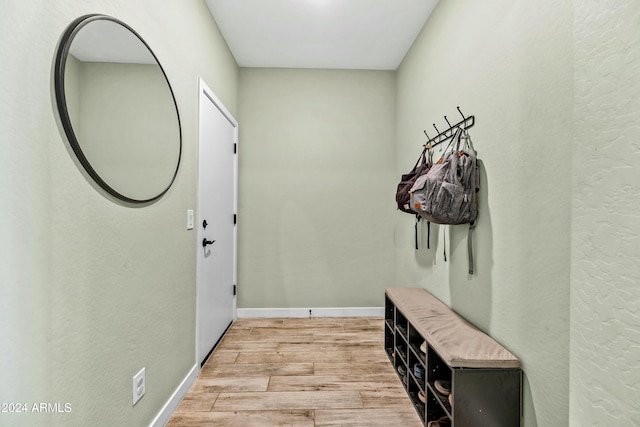 mudroom with light hardwood / wood-style flooring