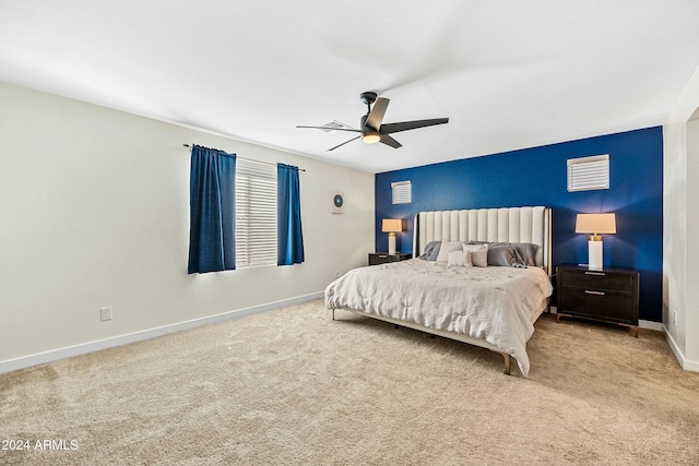 bedroom featuring ceiling fan and light carpet