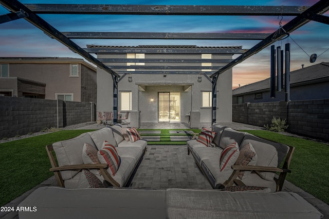 patio terrace at dusk with an outdoor living space, a water view, and a pergola