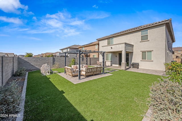 rear view of property with a pergola, outdoor lounge area, a patio area, and a yard