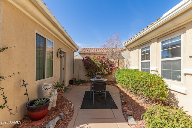 view of patio / terrace featuring fence