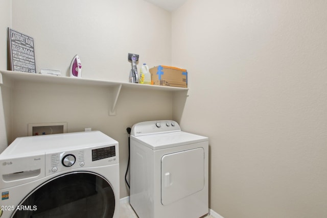 washroom with laundry area and washing machine and clothes dryer