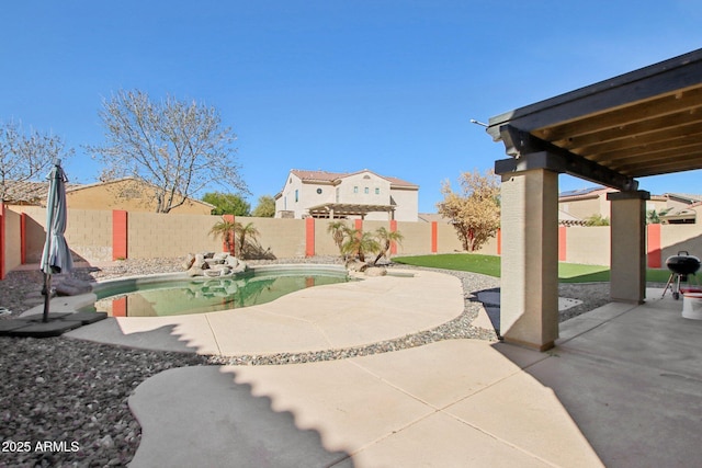 view of patio / terrace with a fenced in pool and a fenced backyard