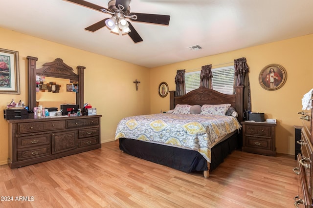 bedroom featuring ceiling fan and light hardwood / wood-style flooring