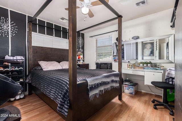 bedroom with ceiling fan and light hardwood / wood-style floors