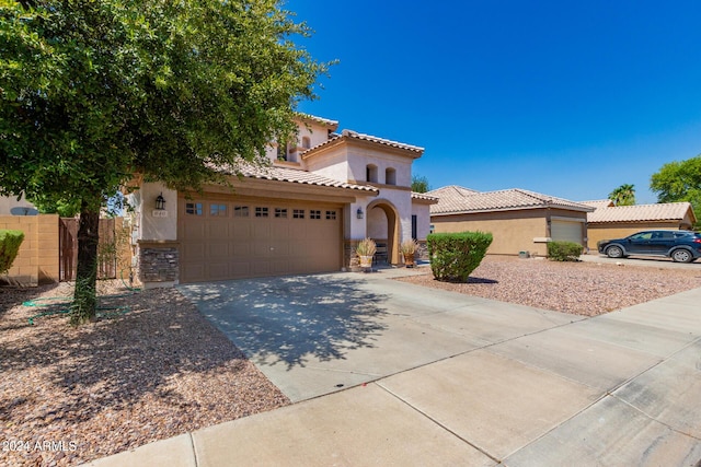 mediterranean / spanish-style house featuring a garage