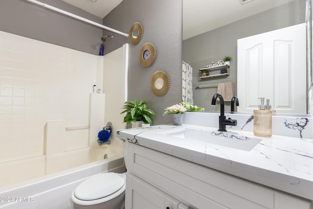 full bathroom featuring toilet, shower / bathing tub combination, and vanity