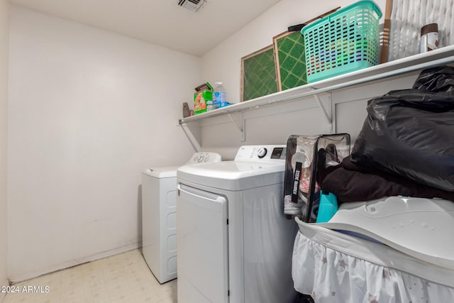 laundry area with separate washer and dryer