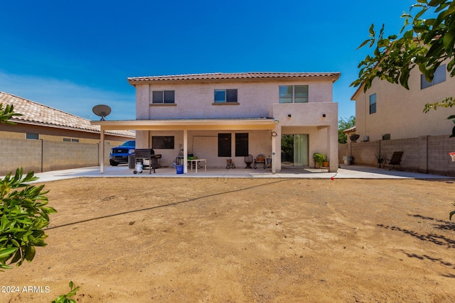 back of house featuring a patio area