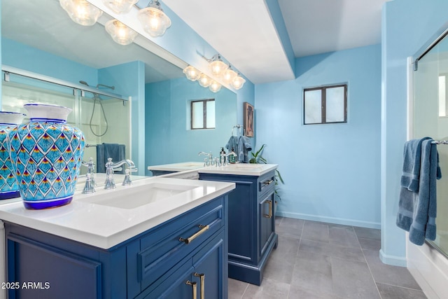 bathroom with vanity, bath / shower combo with glass door, and tile patterned floors