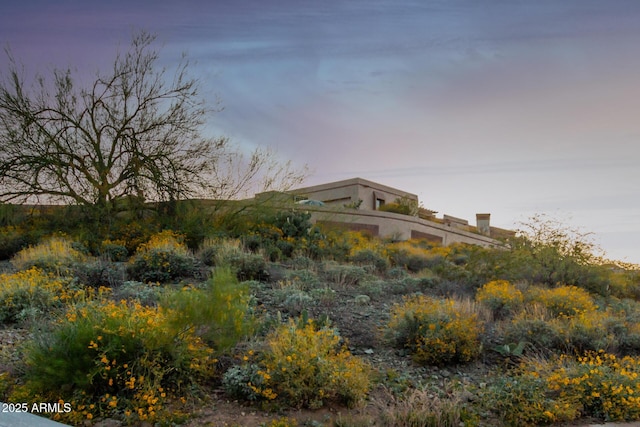 view of property exterior at dusk