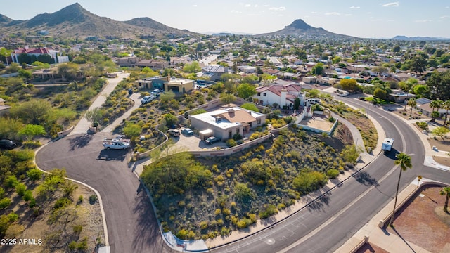 birds eye view of property with a mountain view