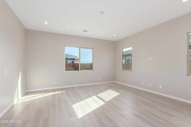 spare room featuring light wood-type flooring