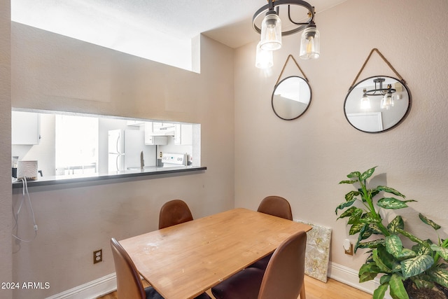 dining area featuring light wood-type flooring