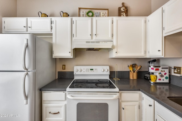 kitchen featuring white appliances and white cabinetry