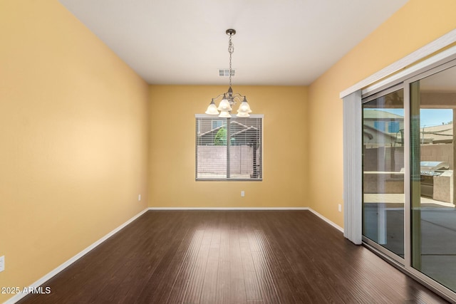 10910 E Sebring Ave, Mesa, AZ 85212 - spare room featuring a chandelier and dark wood-type flooring