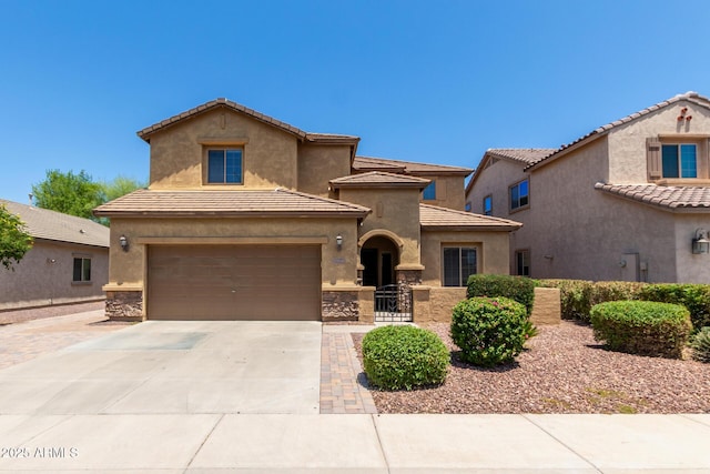10910 E Sebring Ave, Mesa, AZ 85212 - mediterranean / spanish-style house with concrete driveway, a garage, a tile roof, and stucco siding