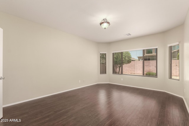 10910 E Sebring Ave, Mesa, AZ 85212 - spare room featuring dark wood-type flooring