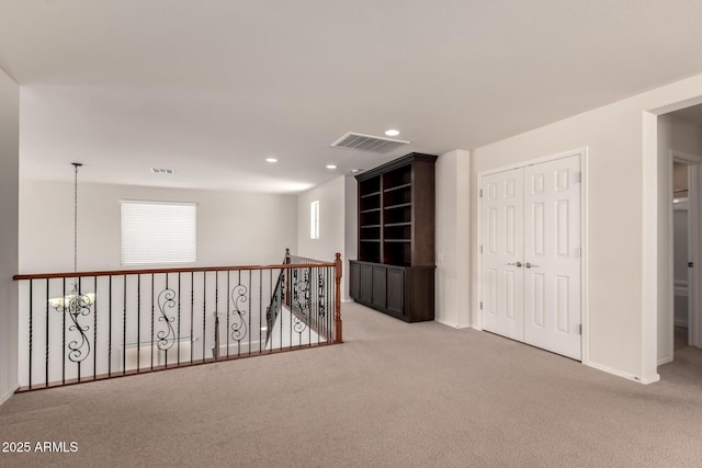 10910 E Sebring Ave, Mesa, AZ 85212 - hall with carpet, recessed lighting, and an upstairs landing