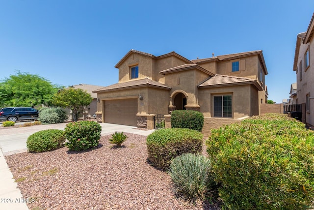 10910 E Sebring Ave, Mesa, AZ 85212 - view of front of house featuring stucco siding, concrete driveway, and a garage