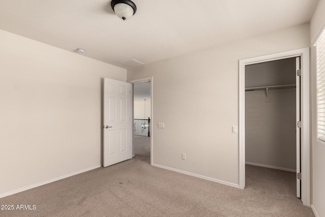 10910 E Sebring Ave, Mesa, AZ 85212 - unfurnished bedroom featuring carpet flooring, a spacious closet, and a closet