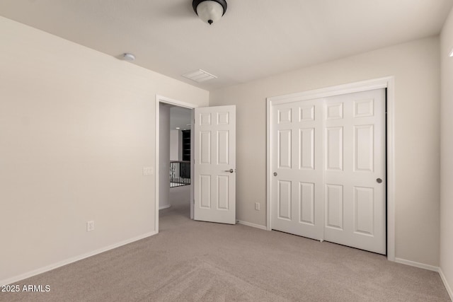 10910 E Sebring Ave, Mesa, AZ 85212 - unfurnished bedroom featuring light carpet and a closet