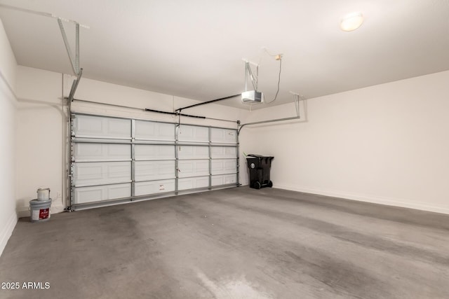 10910 E Sebring Ave, Mesa, AZ 85212 - garage featuring a garage door opener and baseboards