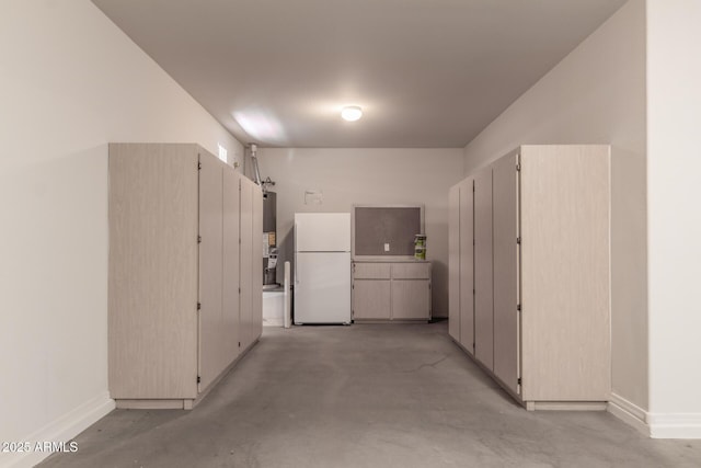 10910 E Sebring Ave, Mesa, AZ 85212 - kitchen featuring freestanding refrigerator, concrete floors, and water heater
