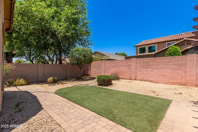 10910 E Sebring Ave, Mesa, AZ 85212 - fenced backyard featuring a patio area