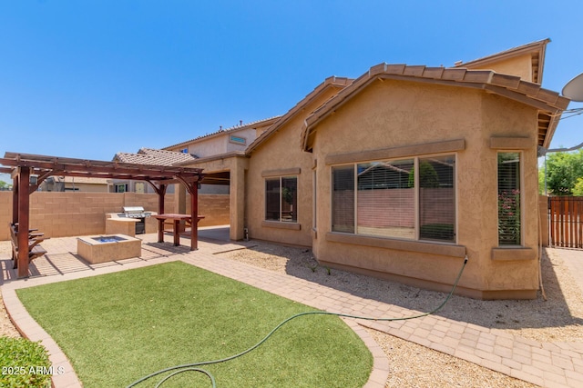 10910 E Sebring Ave, Mesa, AZ 85212 - back of house with a pergola, a patio area, a fenced backyard, stucco siding, and a fire pit