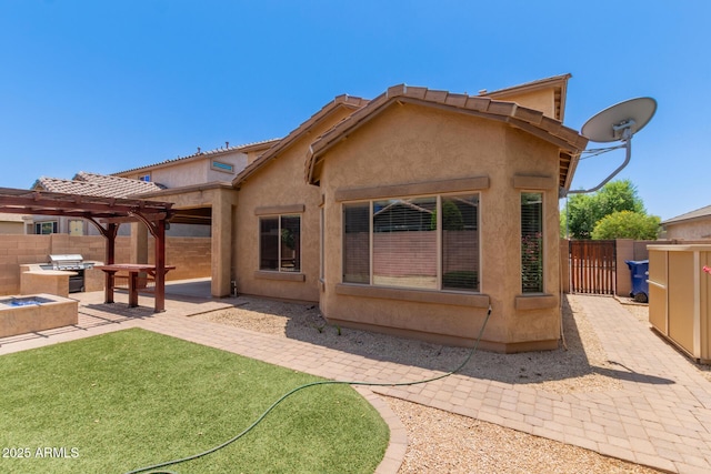 10910 E Sebring Ave, Mesa, AZ 85212 - rear view of house with a patio area, a pergola, an outdoor kitchen, and stucco siding