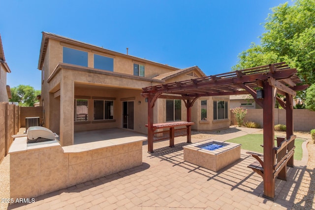 10910 E Sebring Ave, Mesa, AZ 85212 - rear view of house with a patio, exterior kitchen, a fenced backyard, a pergola, and a fire pit