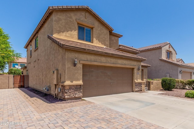 10910 E Sebring Ave, Mesa, AZ 85212 - view of front facade with concrete driveway, stucco siding, and stone siding
