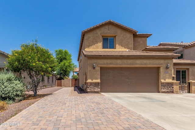 10910 E Sebring Ave, Mesa, AZ 85212 - view of front of home with driveway, stone siding, stucco siding, and a tiled roof