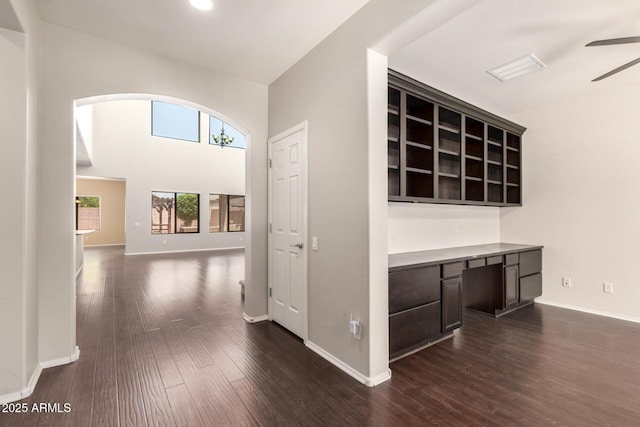 10910 E Sebring Ave, Mesa, AZ 85212 - hall featuring healthy amount of natural light, arched walkways, and dark wood-style floors