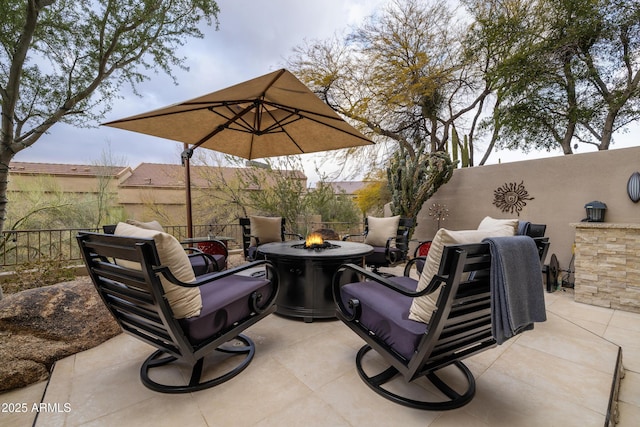 view of patio featuring an outdoor fire pit