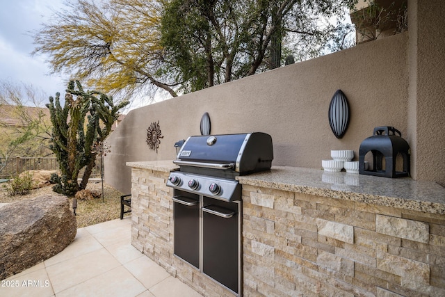 view of patio / terrace featuring area for grilling and exterior kitchen