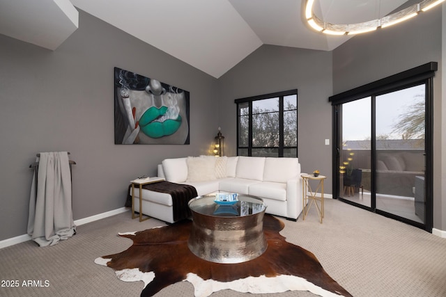 living room with vaulted ceiling and carpet floors