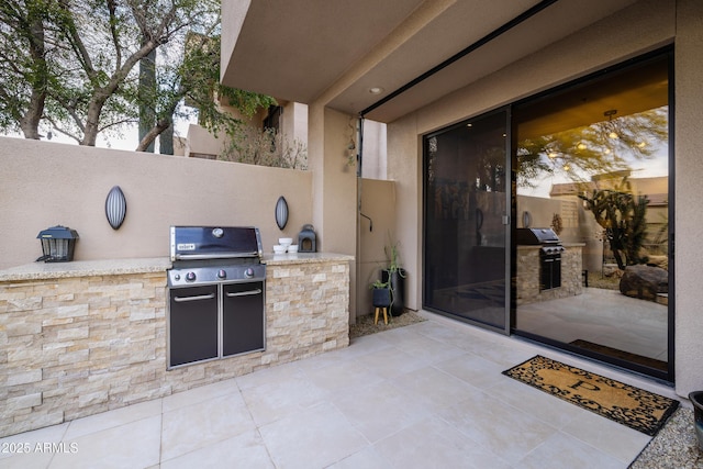 view of patio featuring a grill and exterior kitchen