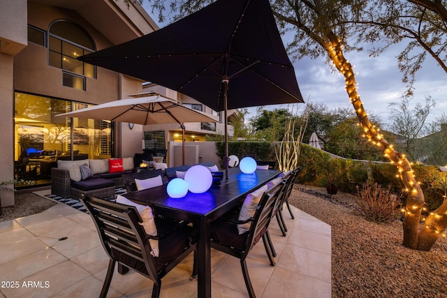 patio terrace at dusk with an outdoor living space