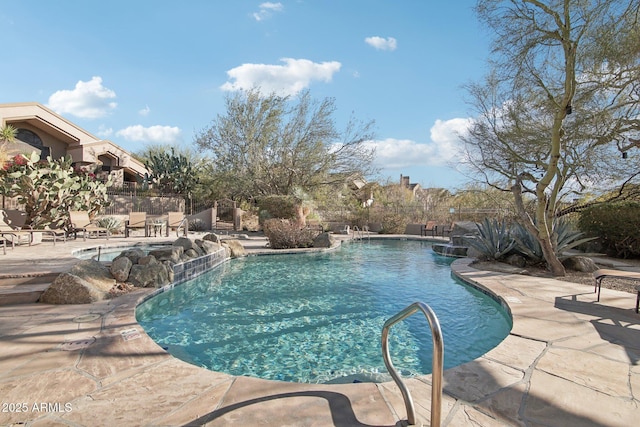 view of swimming pool featuring a patio and pool water feature