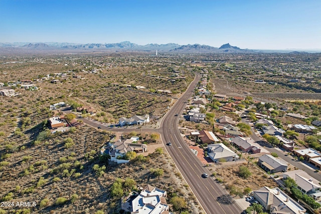 birds eye view of property with a mountain view